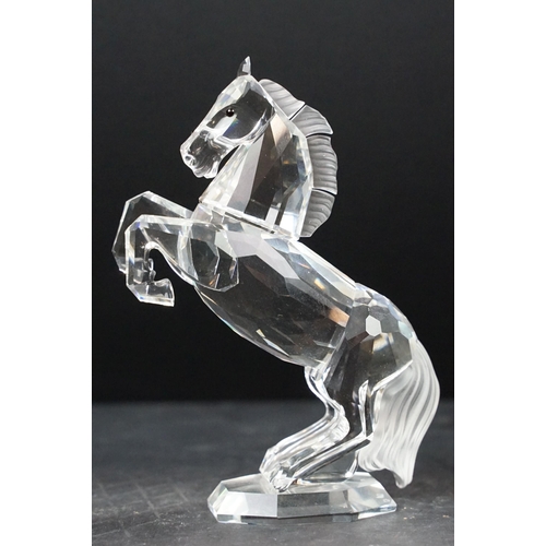 34 - Collection of five Swarovski crystal figurines to include a Pegasus, eagle, horse standing, horse re... 