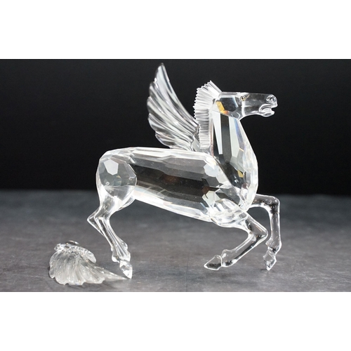 34 - Collection of five Swarovski crystal figurines to include a Pegasus, eagle, horse standing, horse re... 