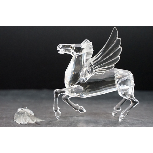 34 - Collection of five Swarovski crystal figurines to include a Pegasus, eagle, horse standing, horse re... 