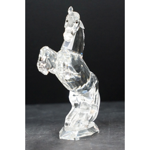 34 - Collection of five Swarovski crystal figurines to include a Pegasus, eagle, horse standing, horse re... 