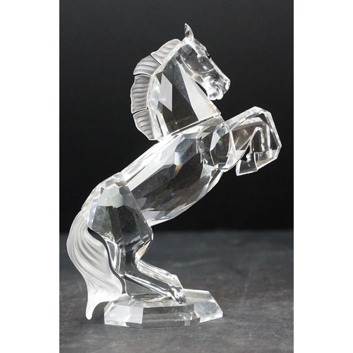 34 - Collection of five Swarovski crystal figurines to include a Pegasus, eagle, horse standing, horse re... 