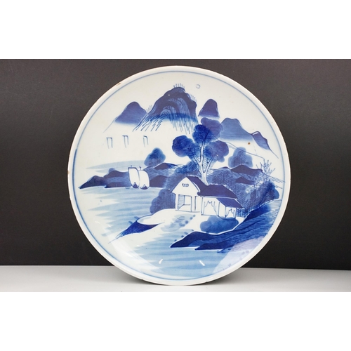 45 - Selection of three Oriental plates, to include a blue and white landscape example together with a Ch... 