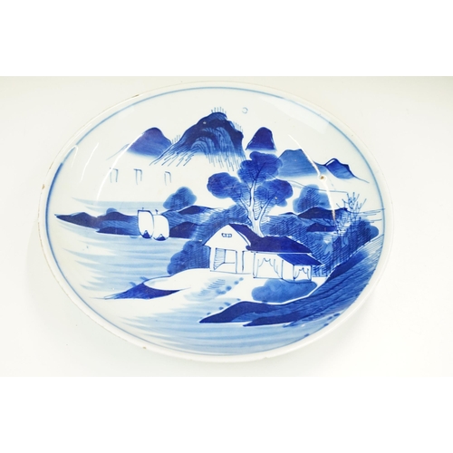 45 - Selection of three Oriental plates, to include a blue and white landscape example together with a Ch... 