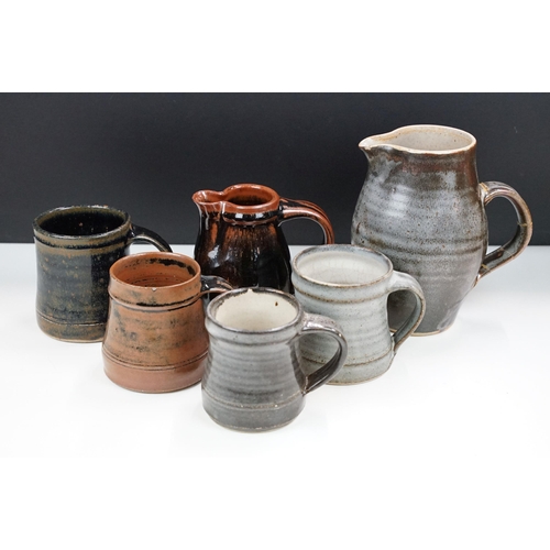 46 - Selection of four Leach pottery studio pottery mugs in varying glazed finishes and colours together ... 