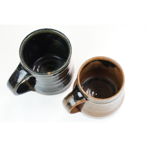 46 - Selection of four Leach pottery studio pottery mugs in varying glazed finishes and colours together ... 