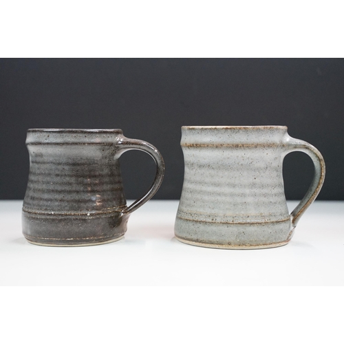 46 - Selection of four Leach pottery studio pottery mugs in varying glazed finishes and colours together ... 