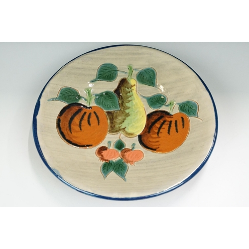 52 - Puigdemont ceramic wall plate with pear and apple fruit design, signed to back. Diameter 24cm