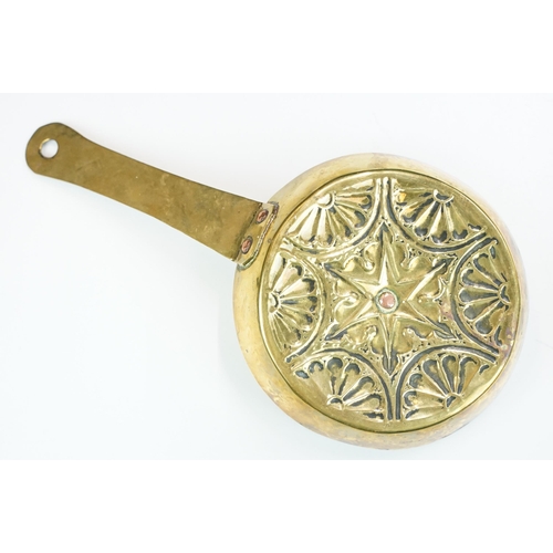 144 - Early 20th century brass chamberstick, with incised and impressed decoration, with copper rivets, 27... 