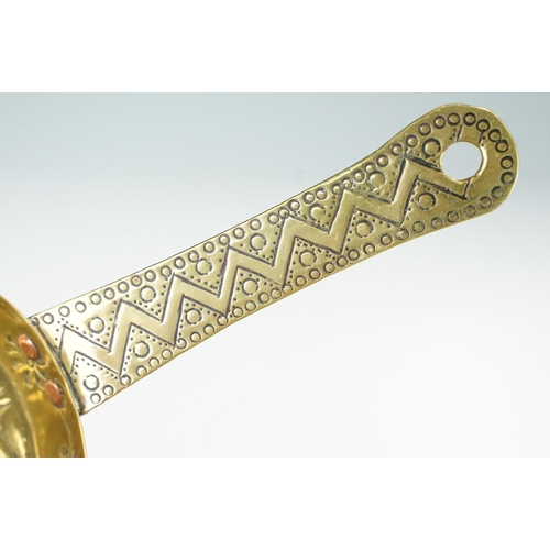 144 - Early 20th century brass chamberstick, with incised and impressed decoration, with copper rivets, 27... 