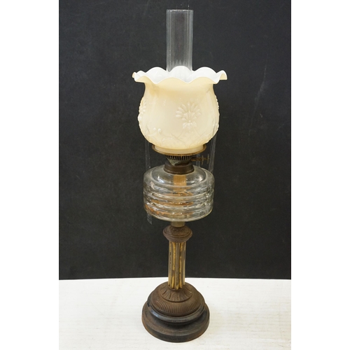 120 - Art Nouveau cast iron oil lamp base, moulded mark 494604, 56cm high in total and two other oil lamps... 