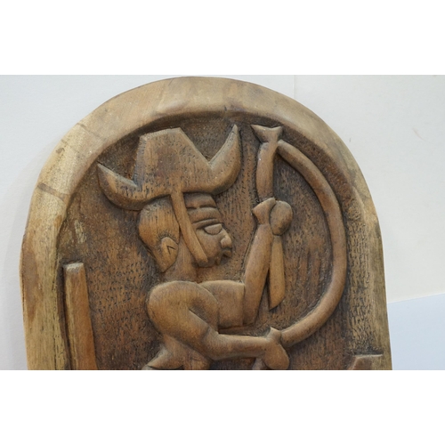 127 - African tribal carved chair back featuring a fisherman and fish to central panel. Measures 134cm tal... 