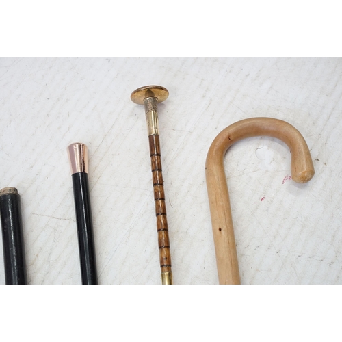 319 - Hallmarked gold tipped walking cane, with monogram to top with tapering black lacquered cane, 90cm l... 