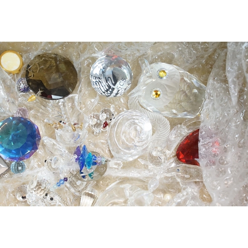 99 - Large collection of Swarovski and crystal pieces to include paperweights, owl, swan, candlestick, sq... 