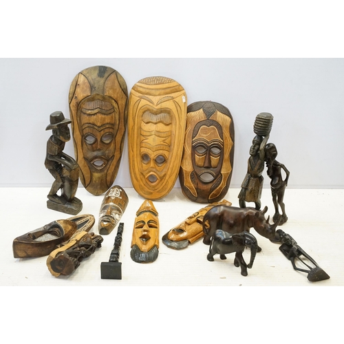 342 - Collection of African carved tribal art pieces to include masks, totems, sculptures, figurines, elep... 