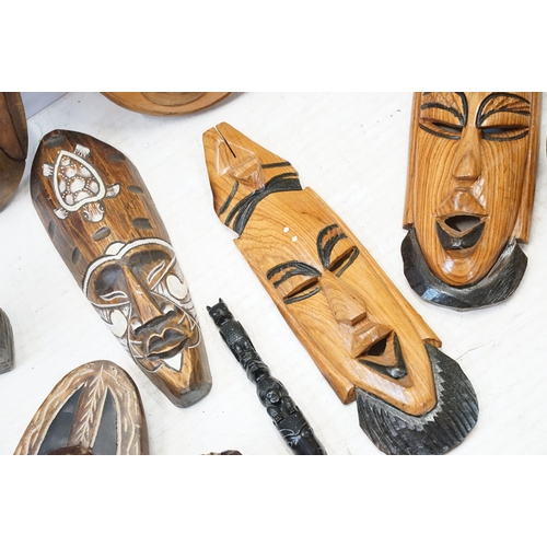 342 - Collection of African carved tribal art pieces to include masks, totems, sculptures, figurines, elep... 