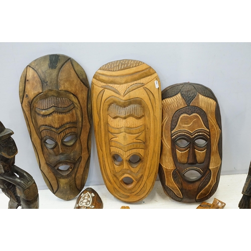 342 - Collection of African carved tribal art pieces to include masks, totems, sculptures, figurines, elep... 