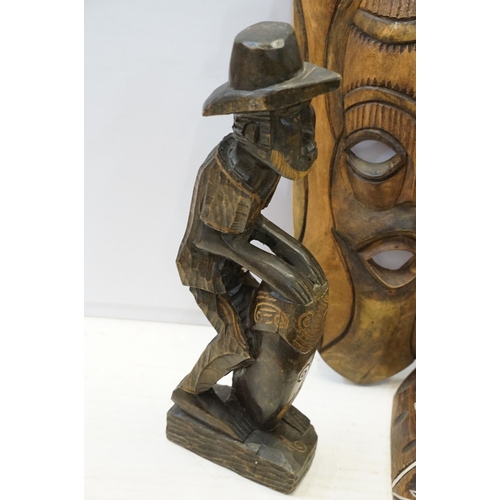 342 - Collection of African carved tribal art pieces to include masks, totems, sculptures, figurines, elep... 