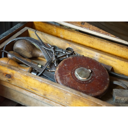 370 - Large wooden tool chest with contents including spirit level, squares, planes, drills saws, etc