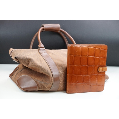 253A - A Mulberry leather planner / filofax together with a a brown leather holdall bag.