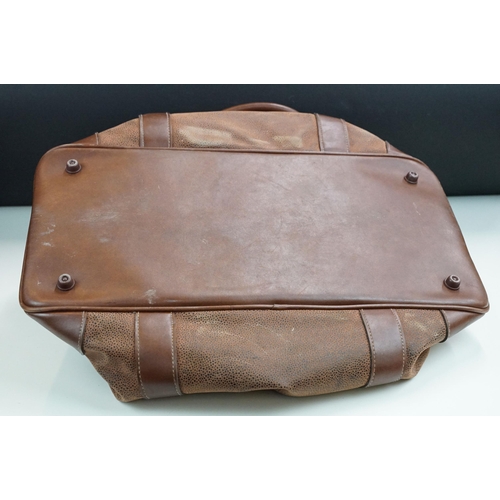 253A - A Mulberry leather planner / filofax together with a a brown leather holdall bag.