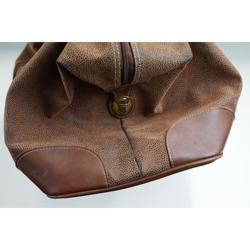 253A - A Mulberry leather planner / filofax together with a a brown leather holdall bag.