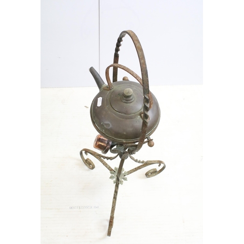 437 - Antique copper kettle on wrought iron base with flower details, H 82cm, together with an antique rus... 