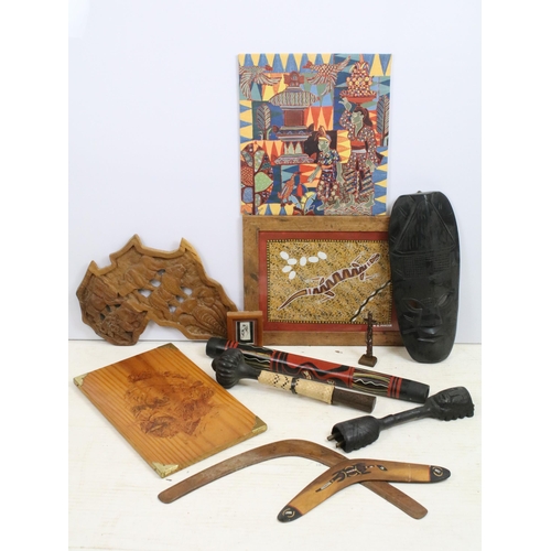 415 - A large selection of African and Aboriginal art and collectables to include mask, boomerang and carv... 