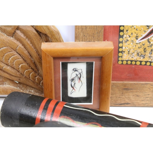 415 - A large selection of African and Aboriginal art and collectables to include mask, boomerang and carv... 