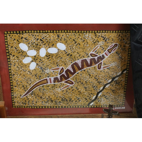 415 - A large selection of African and Aboriginal art and collectables to include mask, boomerang and carv... 