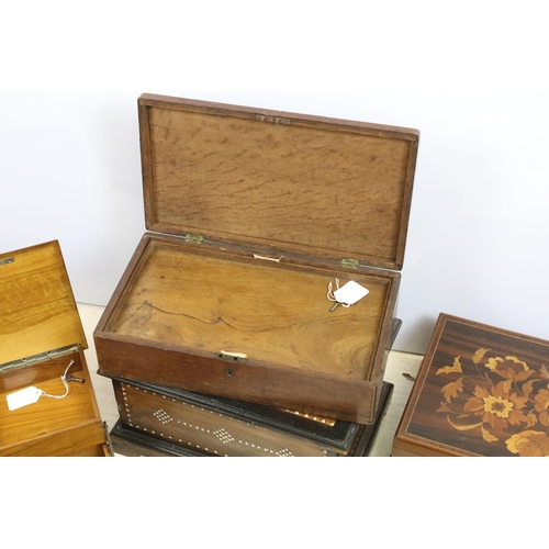 427 - Collection of four boxes, comprising: an early 20th century walnut cantilevered box, opening to thre... 