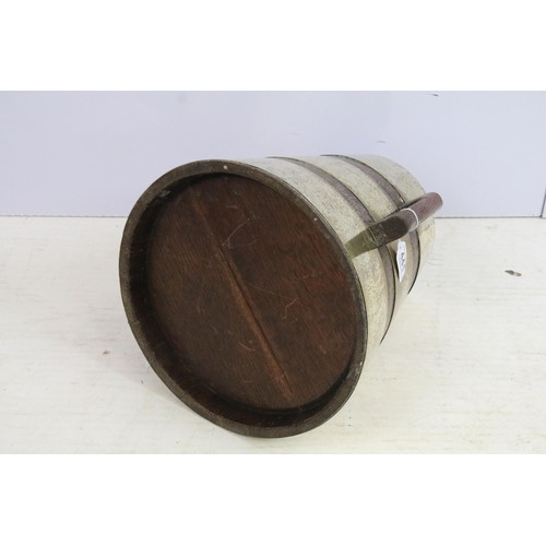 441 - Early 20th century brass and oak conical cask container with side handles, H 34cm, base diameter 32.... 