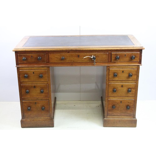 573 - Vixctorian mahogany twin pedestal desk, with an arrangement of nine drawers, some of the brass locks... 