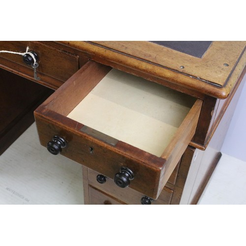 573 - Vixctorian mahogany twin pedestal desk, with an arrangement of nine drawers, some of the brass locks... 