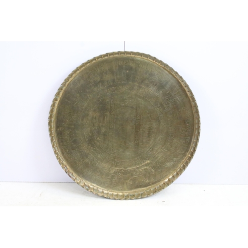 443 - Egyptian brass circular tray with central panel of figures within borders and fluted rim, 69.5cm dia... 