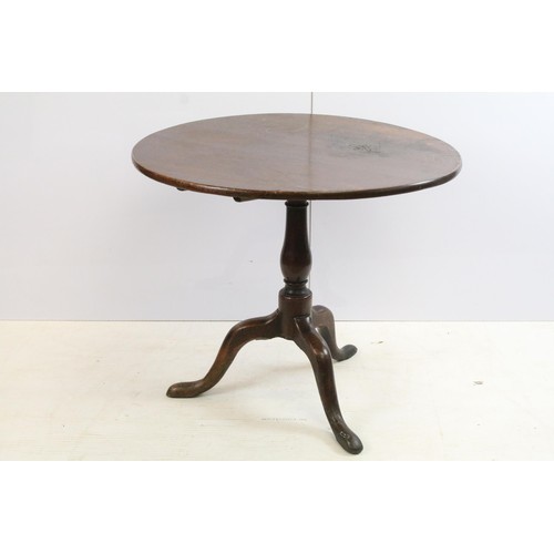 570 - 19th Century oak tilt top table with tripod base, H 68cm diameter 79cm