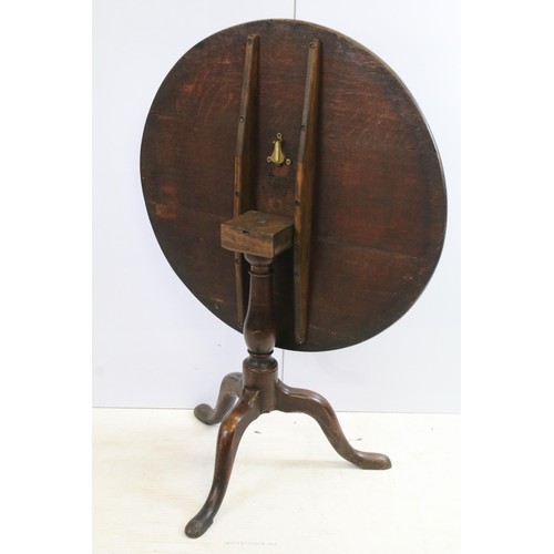 570 - 19th Century oak tilt top table with tripod base, H 68cm diameter 79cm