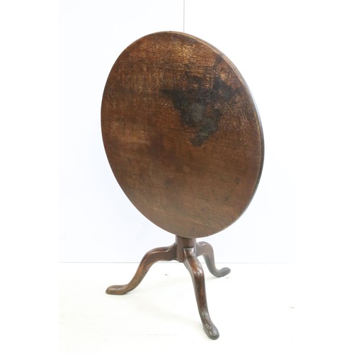 570 - 19th Century oak tilt top table with tripod base, H 68cm diameter 79cm