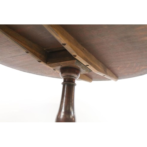 570 - 19th Century oak tilt top table with tripod base, H 68cm diameter 79cm