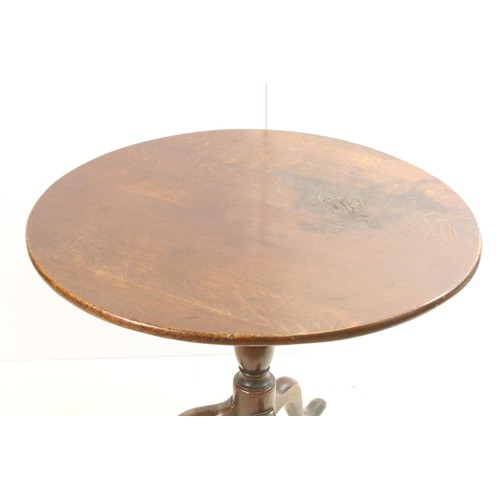 570 - 19th Century oak tilt top table with tripod base, H 68cm diameter 79cm