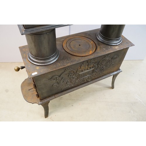 438 - Unusual 19th century Continental cast iron sectional stove of graduated three tiered form, the botto... 