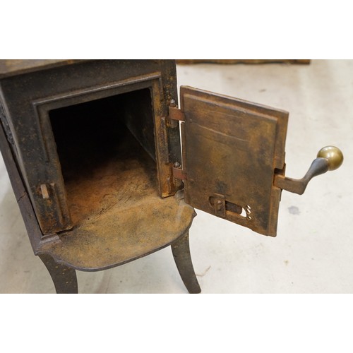 438 - Unusual 19th century Continental cast iron sectional stove of graduated three tiered form, the botto... 