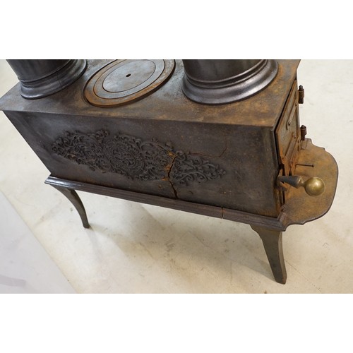 438 - Unusual 19th century Continental cast iron sectional stove of graduated three tiered form, the botto... 