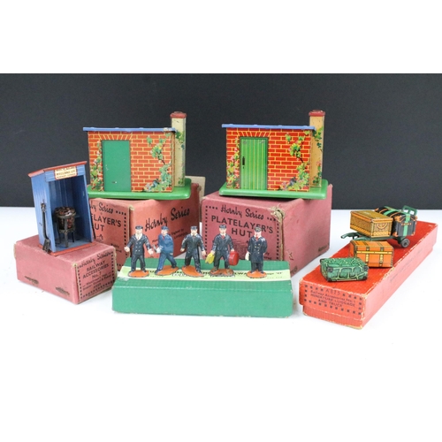188 - Five boxed O gauge trackside accessories and sets to include Dinky No 1 Station Staff and 4 x Hornby... 