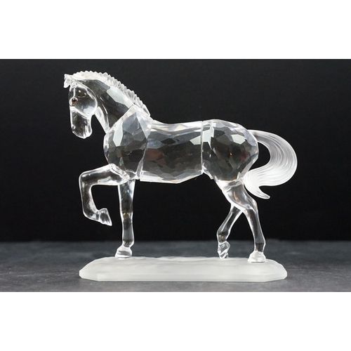 31 - Collection of five Swarovski crystal figurines to include a Pegasus, eagle, horse standing, horse re... 