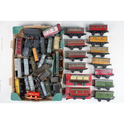 206 - Over 43 O gauge items of rolling stock to include many Hornby examples, featuring wagons, vans, tank... 