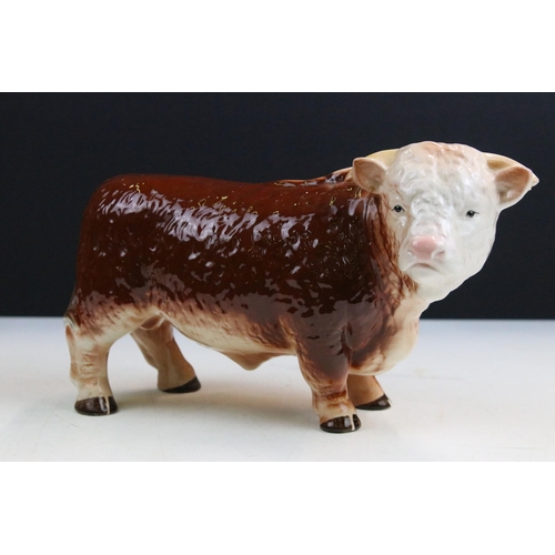 12 - Large Melba ware butcher's Hereford Bull, H 25.5cm together with a smaller Melba ware bull, H 16cm