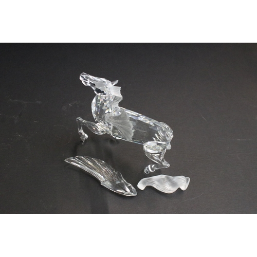 31 - Collection of five Swarovski crystal figurines to include a Pegasus, eagle, horse standing, horse re... 