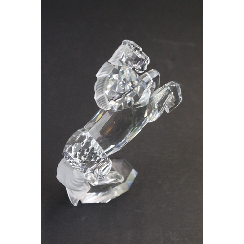 31 - Collection of five Swarovski crystal figurines to include a Pegasus, eagle, horse standing, horse re... 