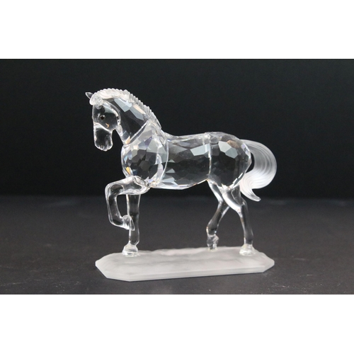 31 - Collection of five Swarovski crystal figurines to include a Pegasus, eagle, horse standing, horse re... 