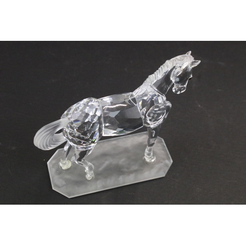 31 - Collection of five Swarovski crystal figurines to include a Pegasus, eagle, horse standing, horse re... 